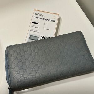 Gucci micro Guccissima light blue zippy wallet